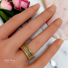 Gold open free-size zirconia ring worn on hand