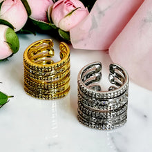 Gold and silver open zirconia rings shown from below