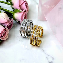 Gold and silver open multi-row zirconia rings