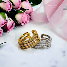 Gold and silver open zirconia rings front view