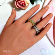 Gold and silver open zirconia rings worn on hand