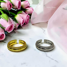 Gold and silver open wedding rings showing adjustable bands