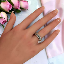 White gold plated open wedding ring with zirconia worn on hand