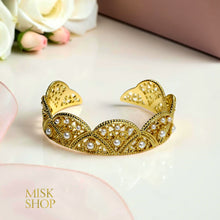 Open cuff pearl fan bracelet close-up
