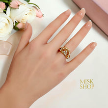 Pearl and zircon lattice ring worn on hand