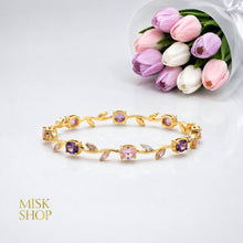 Gold-tone tulip vine bracelet with pink and lilac zircon stones