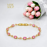 Gold-tone tulip vine bracelet with pink zircon stones