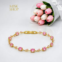 Gold-tone tulip vine bracelet with pink zircon stones