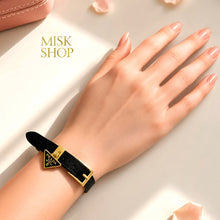 Black Prada triangle-logo adjustable leather bracelet worn on wrist