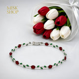 Silver-tone tulip vine bracelet with red and green zircon stones
