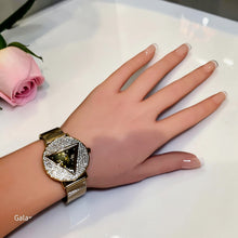 Gold triangular zircon mesh watch styled on the wrist by Misk Shop.