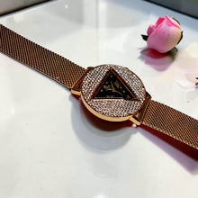 Gold-tone mesh bracelet watch with black triangular dial and zircon by Misk Shop.