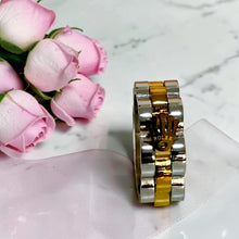 Close-up of two-tone Rolex-inspired stainless steel ring