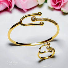 Close-up of Misk Shop Tiffany inspired yellow gold plated copper bangle and ring set with high-clarity zircon