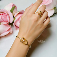 Misk Shop Tiffany inspired yellow gold plated bangle and free-size ring set with high-clarity zircon styled on a hand