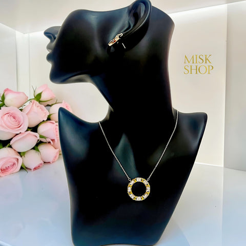 Tiffany-inspired two-tone zircon circle pendant necklace on display