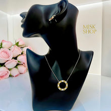 Tiffany-inspired two-tone zircon circle pendant necklace on display