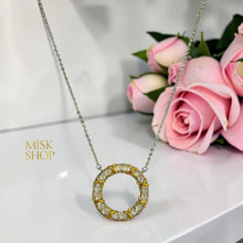Two-tone zircon circle pendant with 21K gold X accents