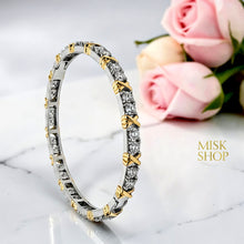 Two-tone Tiffany-inspired zircon X-detail bangle front view