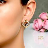 Gold Tiffany-inspired zircon X drop earrings worn