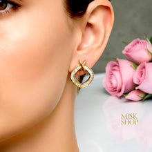 Gold Tiffany-inspired zircon X drop earrings worn