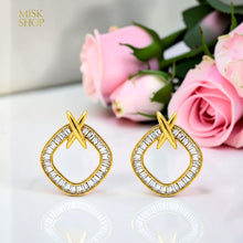 Gold zircon X drop earrings front view