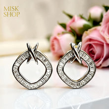Silver zircon X drop earrings front view