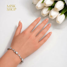 Silver-tone clear zircon tulip bracelet styled on the wrist