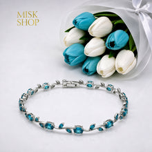 Silver-tone tulip vine bracelet with turquoise zircon stones