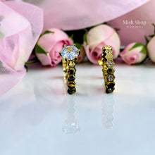 Gold twin wedding ring set with high-clarity zircon stones