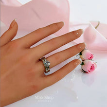 Silver twin zircon ring set shown on hand