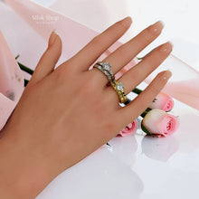 Gold and silver twin zircon ring sets shown on hand