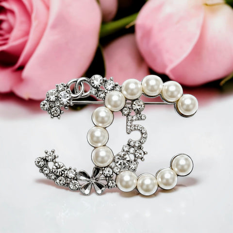 Handcrafted white gold plated Chanel-inspired brooch with pearls and zircon stones by Misk Shop.